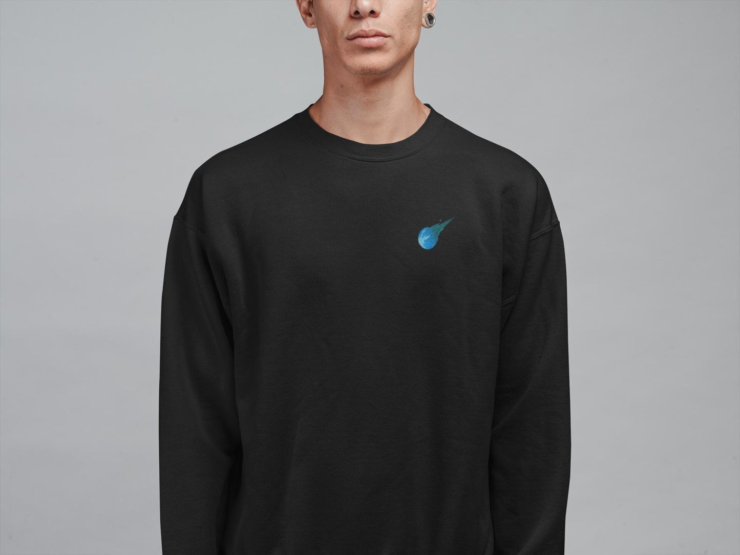 Stained glass style Final Fantasy meteor logo on a black sweater.