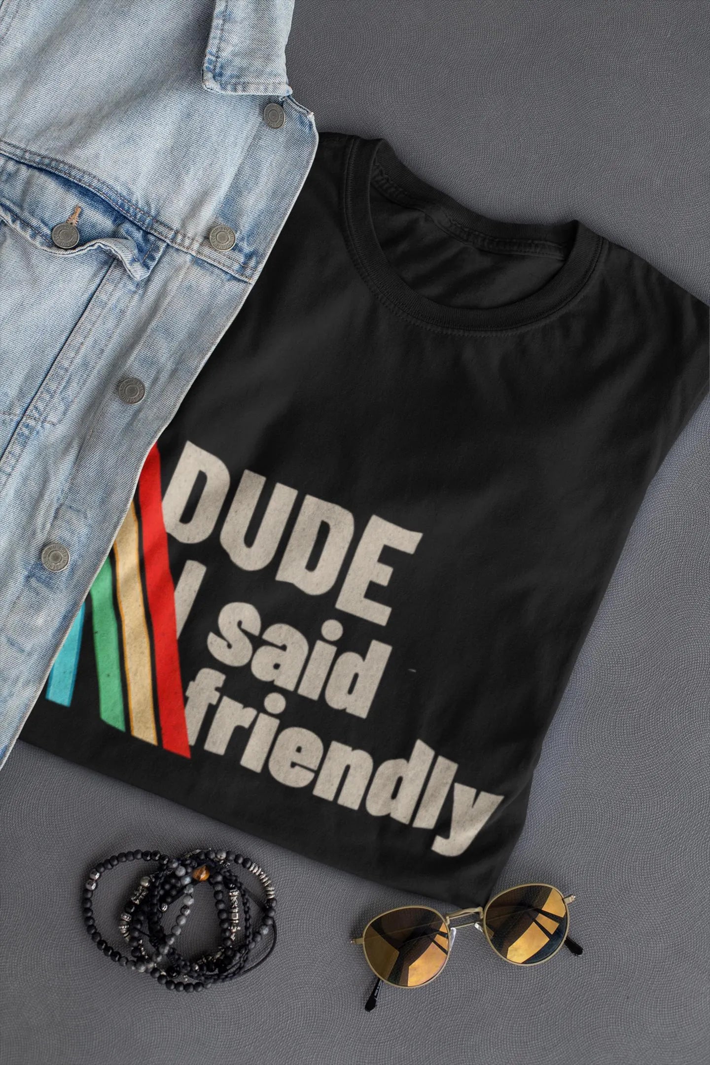 Close-up of Arc Raiders “Dude I Said Friendly” front graphic on black cotton shirt